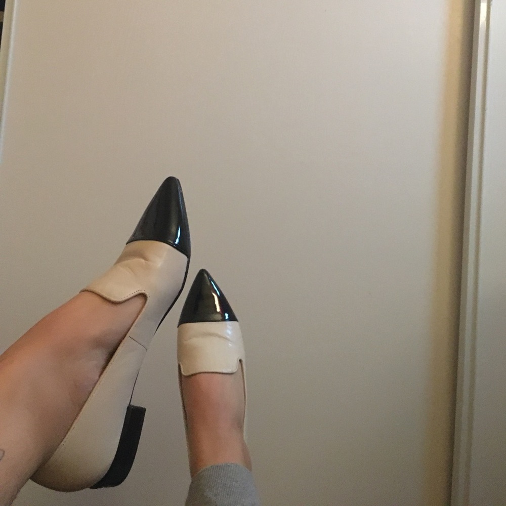 Black and off white flats, never worn.